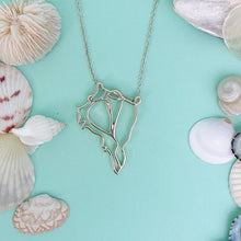 Load image into Gallery viewer, captiva pendant necklaceon turquoise background with mixed shells