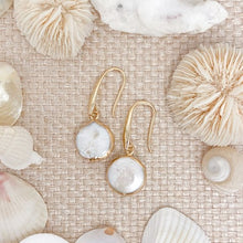 Load image into Gallery viewer, the beach and back small freshwater disc pearls on tan woven background with shells drops