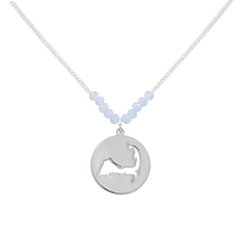 Load image into Gallery viewer, the beach and back cape cod necklace in silver with pale blue beads at center of chain and coin shape pendant with cutout silhouette of cape cod
