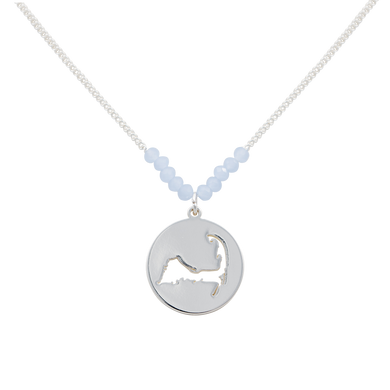the beach and back cape cod necklace in silver with pale blue beads at center of chain and coin shape pendant with cutout silhouette of cape cod
