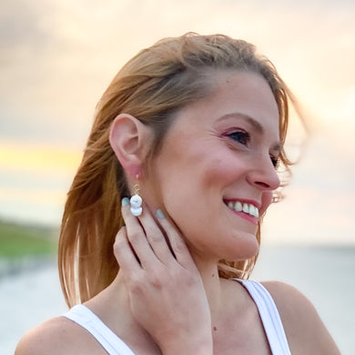 the beach and back ocean springs figure eight pearl drop earrings on model