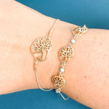 Load image into Gallery viewer,  stack of ocracoke  single and triple slider bracelet with atlantic natica shells with turquoise accents  tbabbr0007-gold
