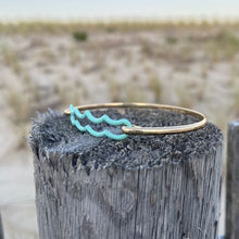 Load image into Gallery viewer, the beach and back signature wave bracelet on textured wood post at beach
